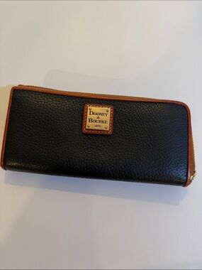Dooney & Bourke Black Pebbled Leather Zip Wallet with Brown Trim